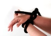 2986365-pictures-of-the-hands-of-a-person-tied-up-with-black-rope